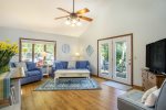 Bright and welcoming living room with soaring ceilings.